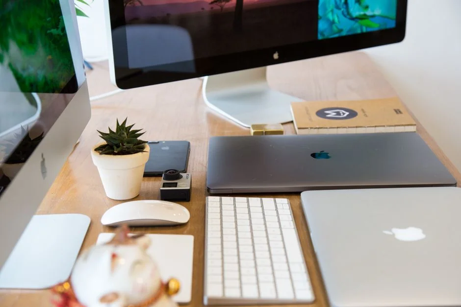 Two coworkers engaged in a productive strategy meeting at a modern office desk.